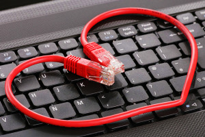 picture of keyboard with a data cable forming a heart.