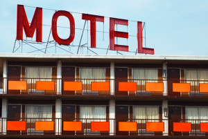 Large MOTEL sign above a retro-era motel